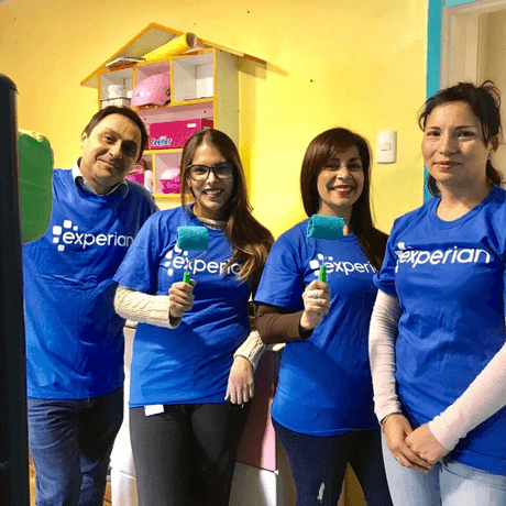 4 of 13 logos - Experian people wearing t shirts and painting