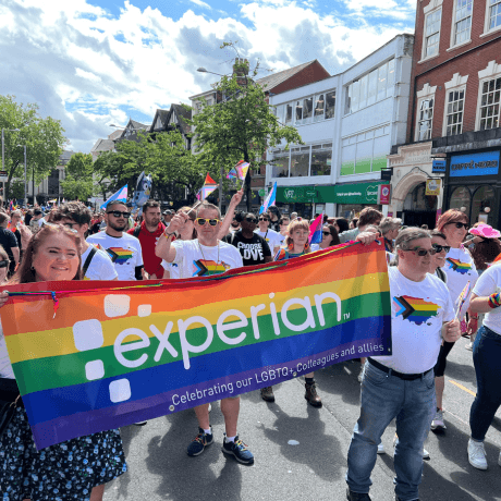 6 of 11 logos - People at Pride with rainbow flags and t shirts 