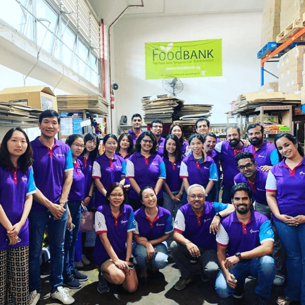 11 of 17 logos - People in Experian t shirts at a Food Bank